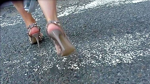 Woman Walking In High Beige Studded Sandals
