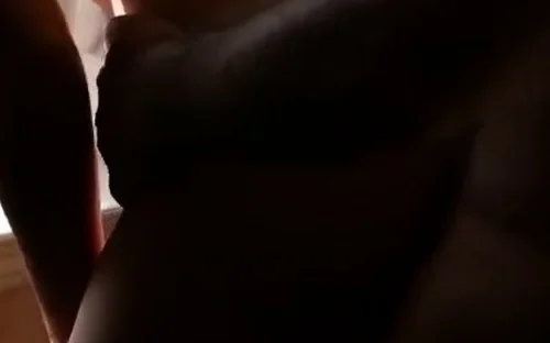 MILF masturbation by the window
