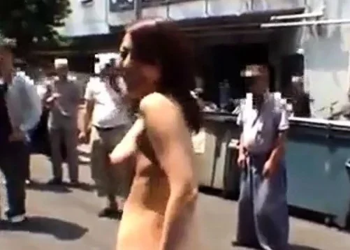 Japanese girl strips naked in crowded area