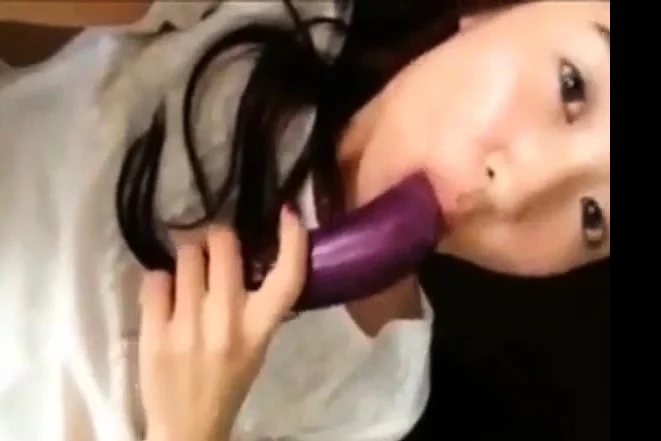 hot korean teen masturbates using eggplant