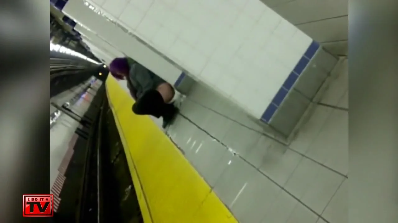 Wicked purple-haired babe makes water at the subway