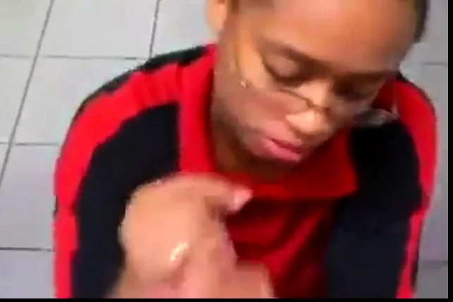 Cashier gives a random guy a public bathroom blowjob