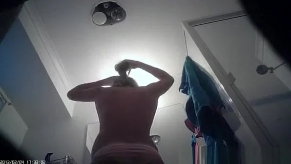 Hot blonde undresses and showers