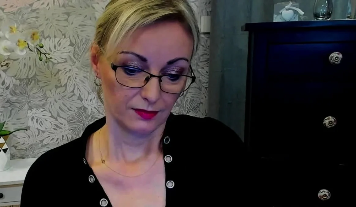 Blonde MILF takes off bra on webcam