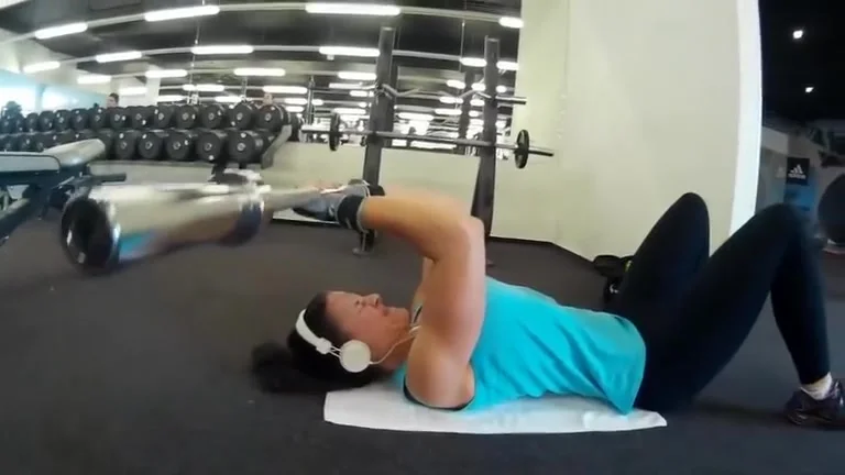 Fitness girl training biceps triceps