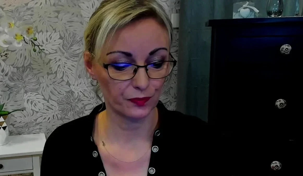 Blonde MILF takes off bra on webcam