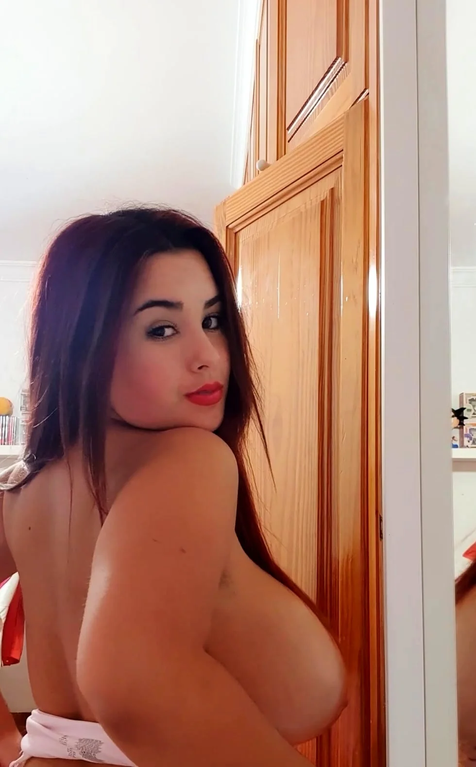 Busty curly brunette with big boobs fucks on couch