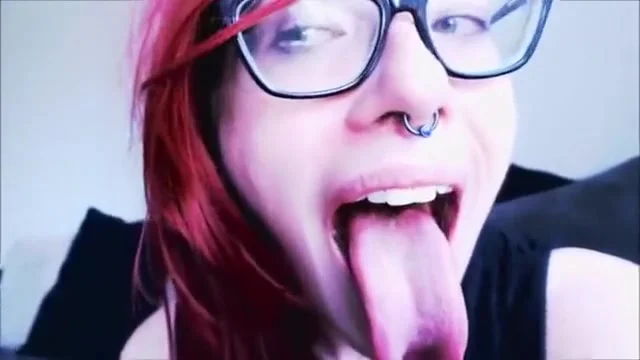 Nerdy Red-Haired Bombshell Teases The Camera With Her Sexy