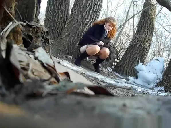 Taking a pee outdoors in a cold winter day