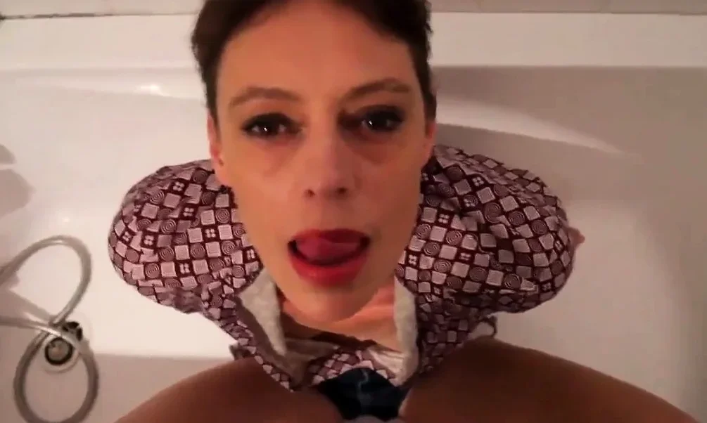 Short hair mature takes facial in the bathtub