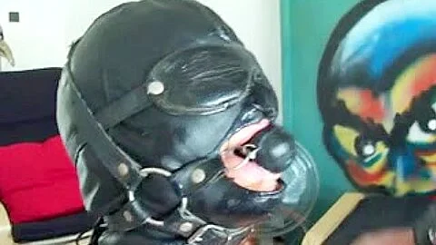 Masked babe with tortured breasts sucks a big dick