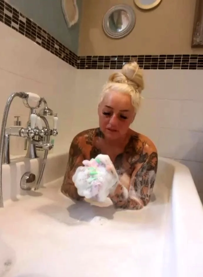 Busty amateur milf masturbates in the shower