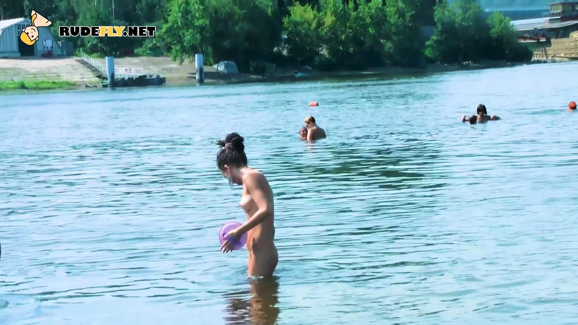 Hot nudist teen filmed by voyeur as she sits naked outside