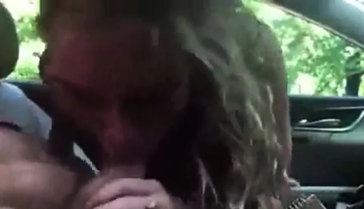 Excited Blonde Blowing In A Car