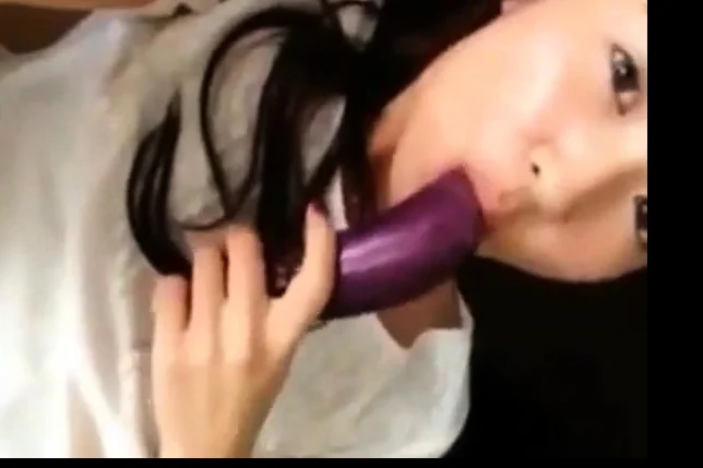 hot korean teen masturbates using eggplant