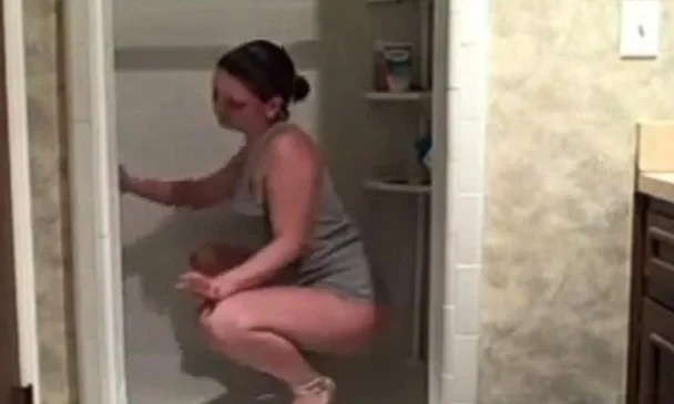 Hot milf cleaning the shower showing her ass