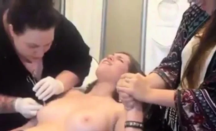Young Girl gets Nipples Pierced
