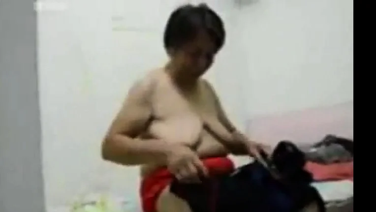 Asian Grandma get dressed after sex