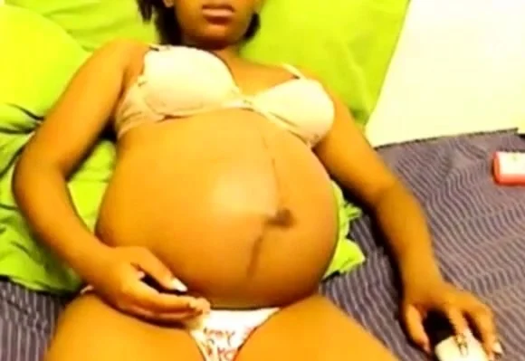 Heavily pregnant black cam chick