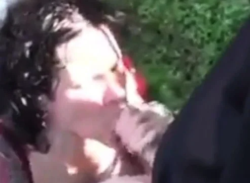 Tatooed slut jerking off several guys in the woods