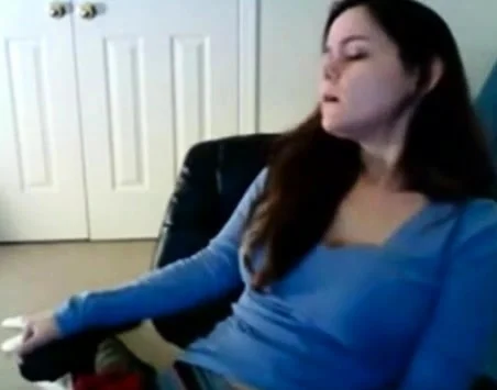 Babe has her hand down her sweat pants masturbating on cam