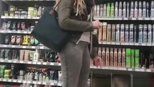 Tight jeans girl at supermarket