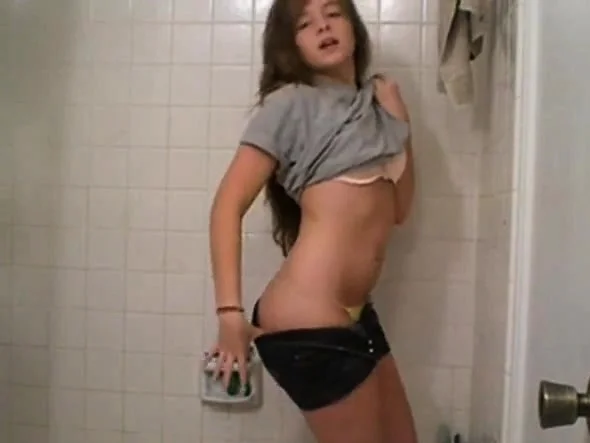 Girl undressing in the bathroom (not nude)