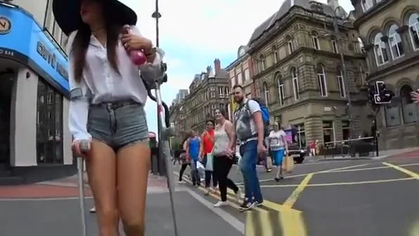 Injured woman in tight shorts