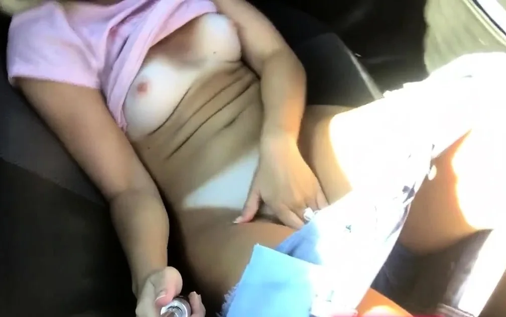 Sexy blonde masturbates in the car