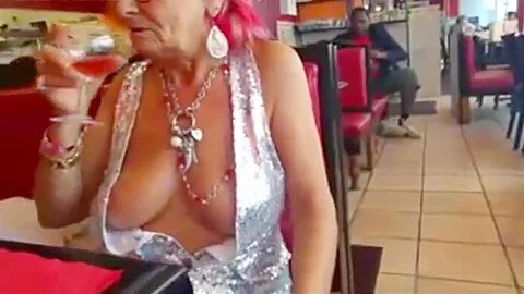Old woman showing off her big chest