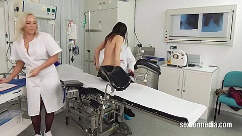 Gynecologist And His Assistant Examine Patients