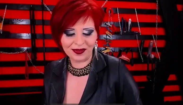 Seductive Red Head Dom Milf Smoking On Cam In Boots