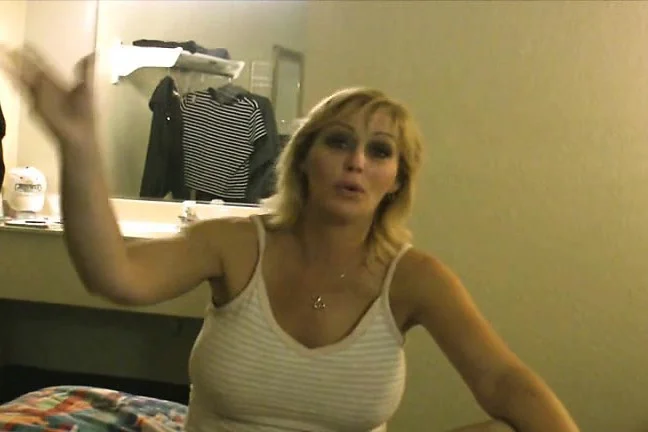 Blonde hooker exposes her big natural boobs and gives a deep blowjob