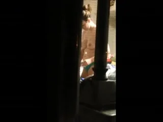 Topless chick in window