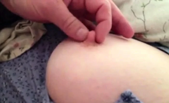 sneaky peep at her big boob as she napps.