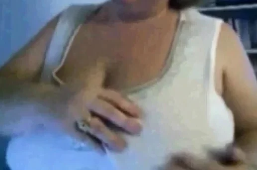 Mature Nancy playing with her boobs on webcam