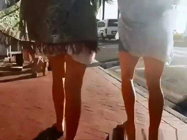 Wind lifts girls dresses exposing their nice asses