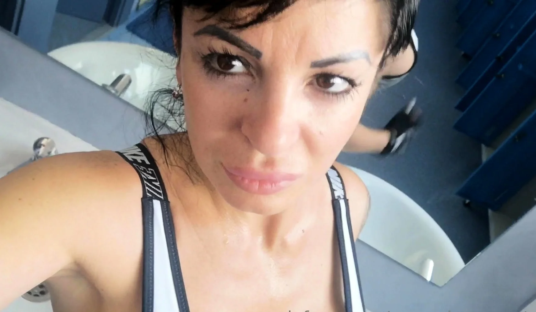 Busty curly brunette with big boobs fucks on couch