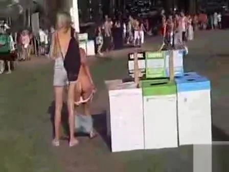 She took a piss while sitting on the ground