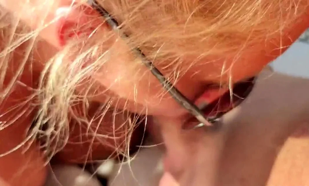 Sucking a big cock outdoors on a sunbed.