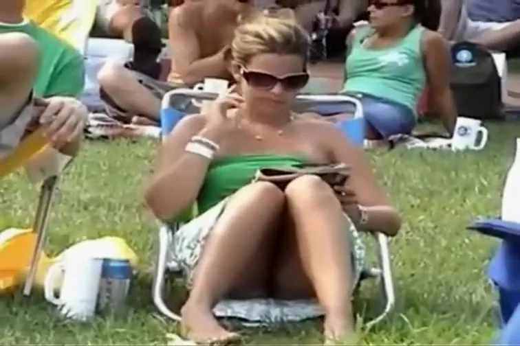 Bulging pink panties spied while she sits