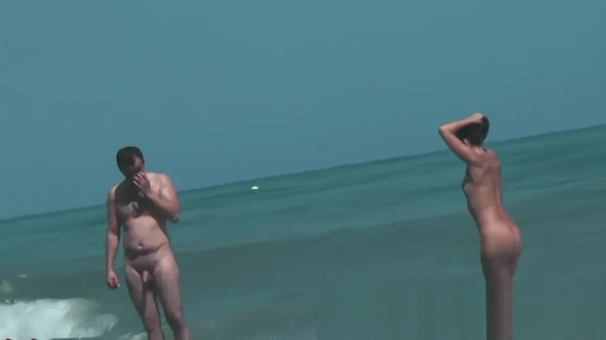 Sexy beach nudist girls get their hot booties admired