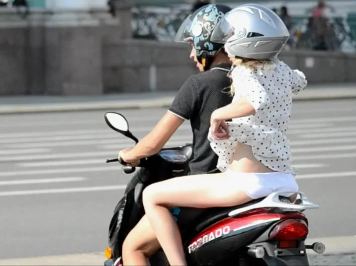 Girl on motorcycle shows some skin