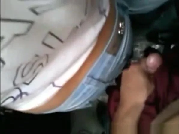 Dude strokes cock in crowded place