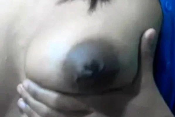 Squeezes out milk from her dark nip ttis