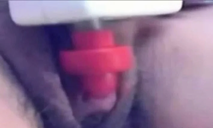 a woman pumps her clit into a dick