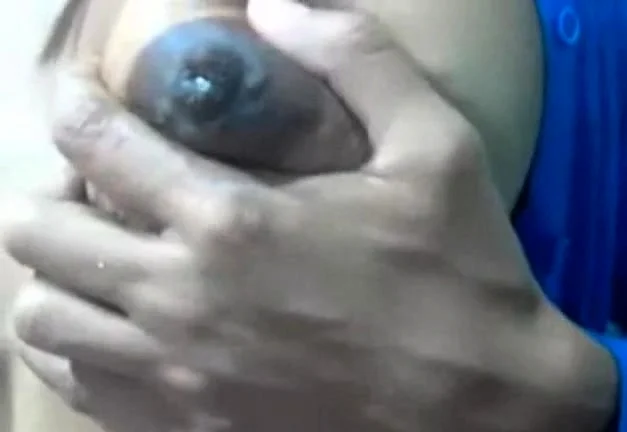 Squeezes out milk from her dark nip ttis
