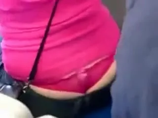 Admiring a nicely peeking pink thong
