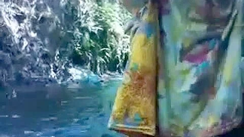 Indo malay bathing at a river