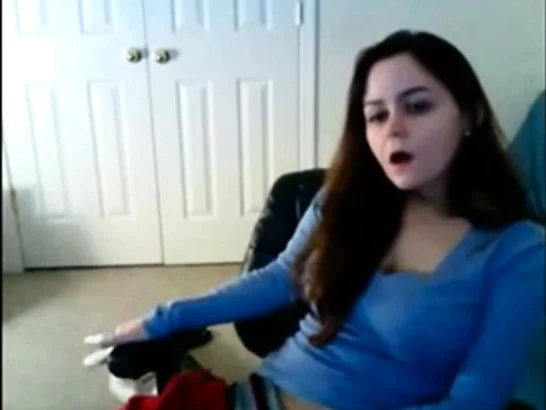 Babe has her hand down her sweat pants masturbating on cam